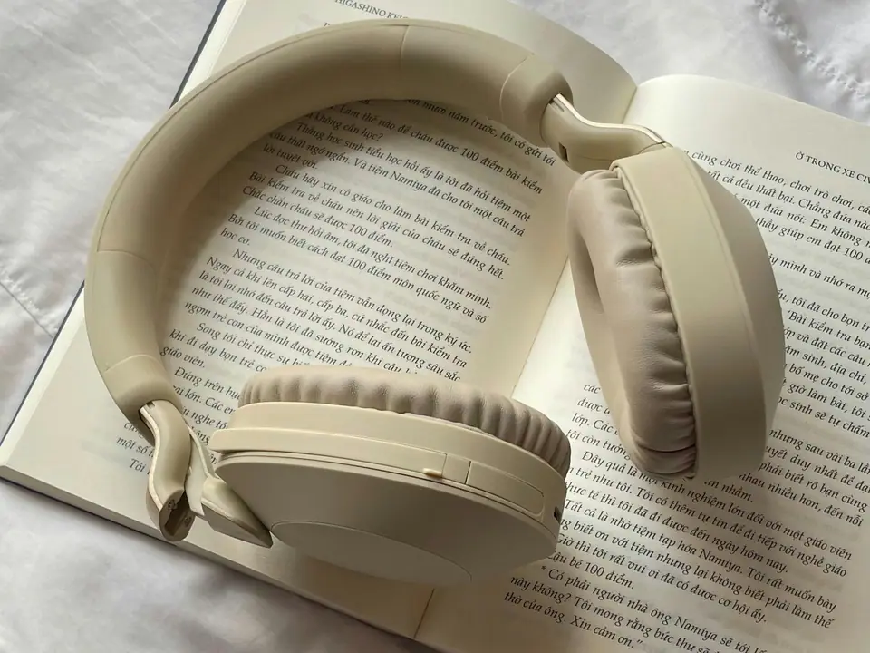 Headphones resting on an open book
