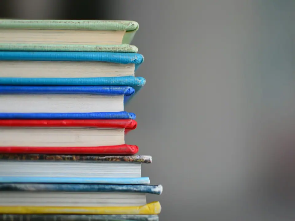 A neat stack of hardcover books