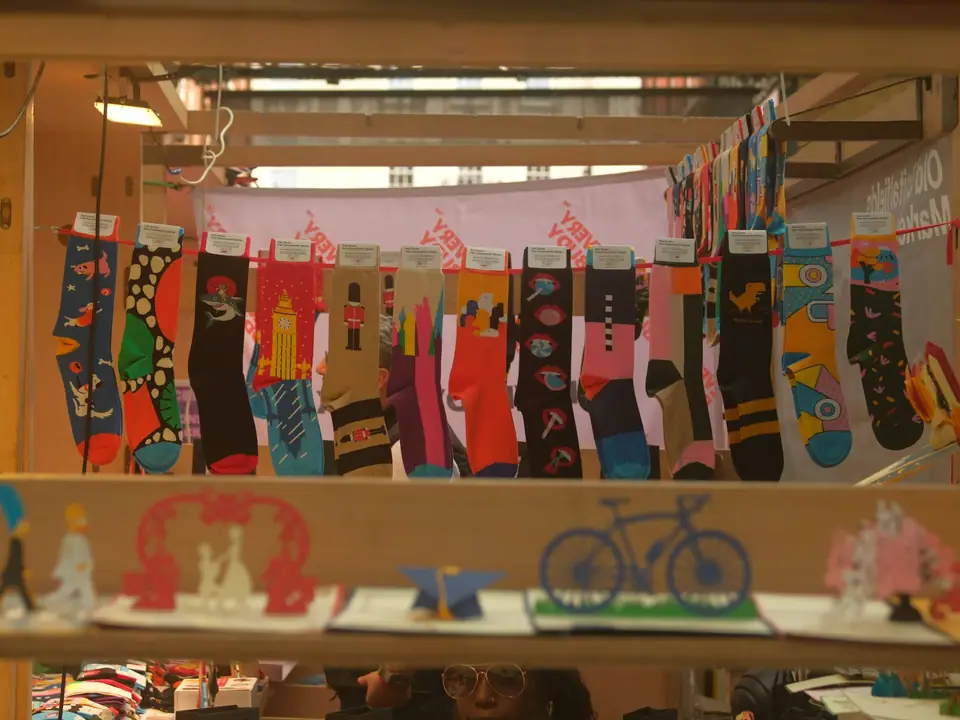 Brightly patterned socks hanging on display